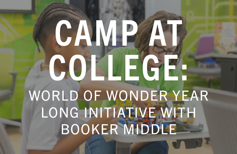 Camp at college - young boy working with USF faculty in the Collaboratory