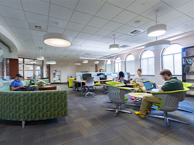 A group of USF students sitting in the Information Commons.