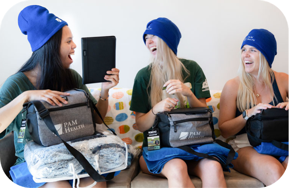Students recieving donated items from PAM Health