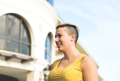 USF student smiling on campus.