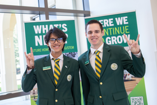 two student ambassadors posing go bulls
