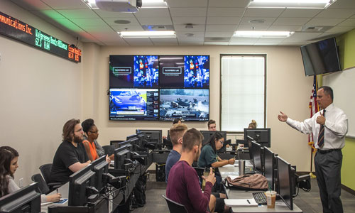 Instructor and students in a classroom.