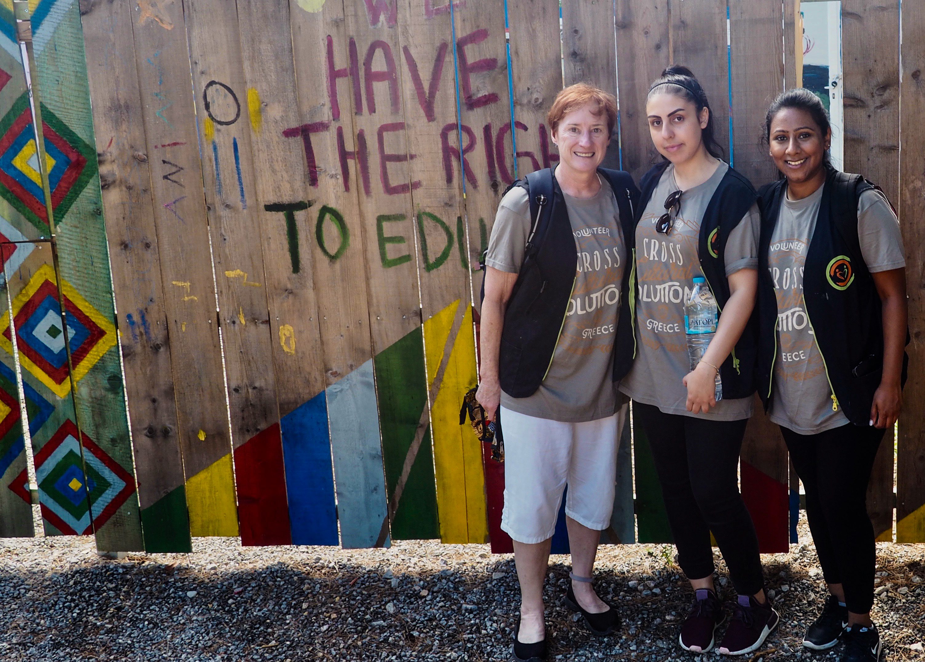 Jody McBrien, PhD, works with volunteers at the Ritsona Refugee Camp in Greece.