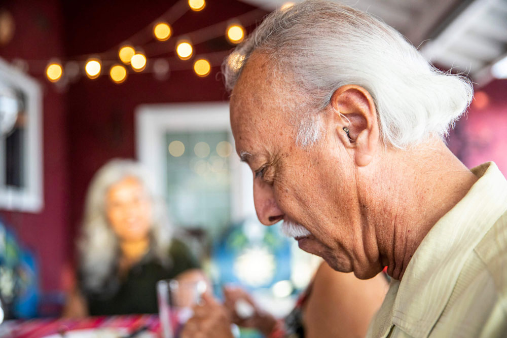 Elderly man with hearing aid