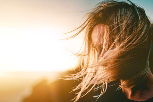 Girl wind blowing in hair.