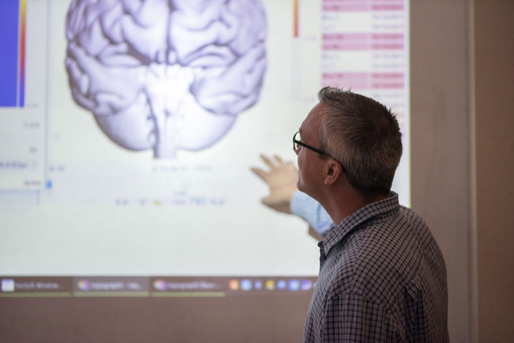 Professor explaining image of brain