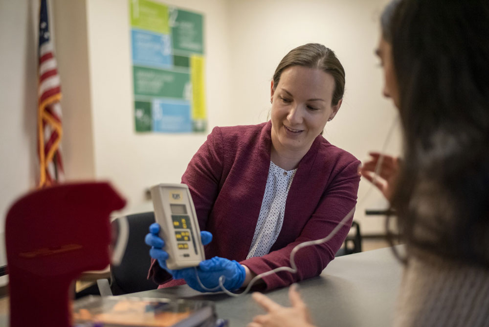 speech-language pathologist Sarah Szynkiewicz working with patient