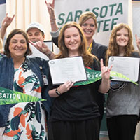 Students celebrating at Educator Signing Day