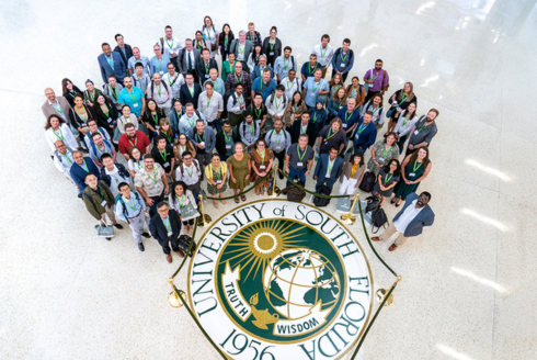 Faculty group photo looking up at camera
