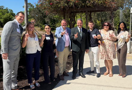 The STC Interns, Luke Bencie and Jay Riley pose with President Limayem at Brunch on the Bay