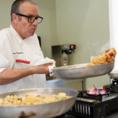 Chef Thompson tossing pasta